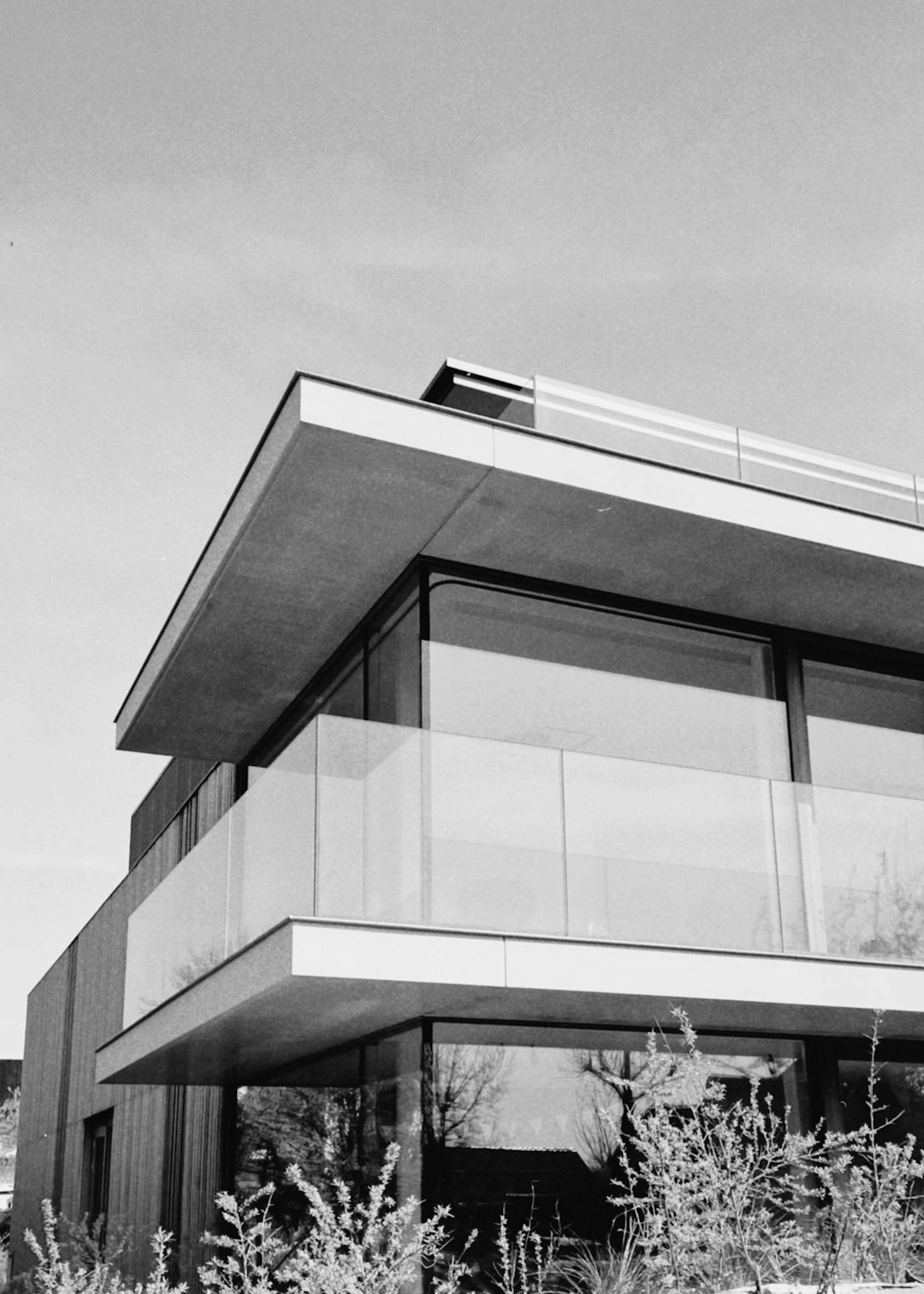 a-black-and-white-photo-of-a-building-xq6btwml6hg